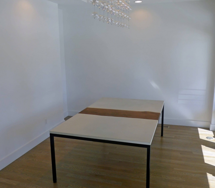 walnut, concrete, and steel dining table