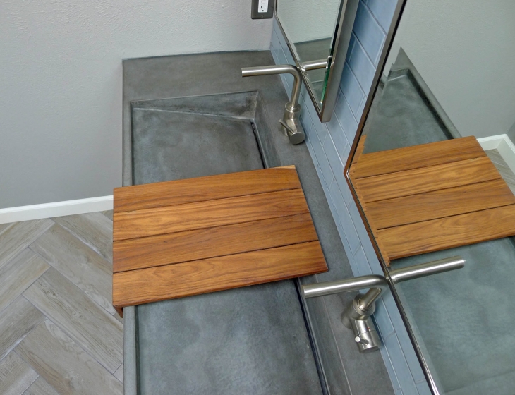 Concrete ramp sink with teak shelf