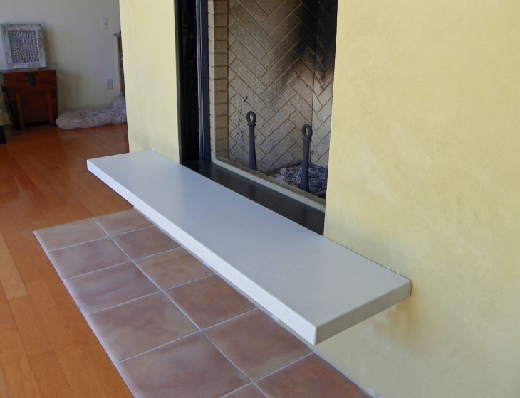 White concrete fireplace hearth