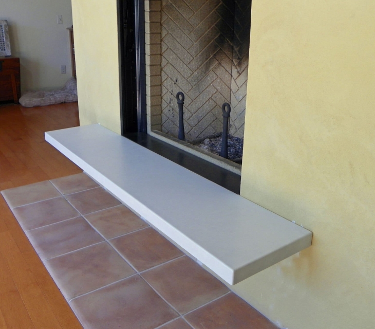 White concrete fireplace hearth