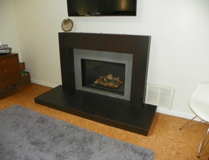 Boulder concrete fireplace surround