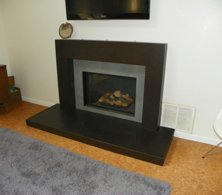 Boulder concrete fireplace surround