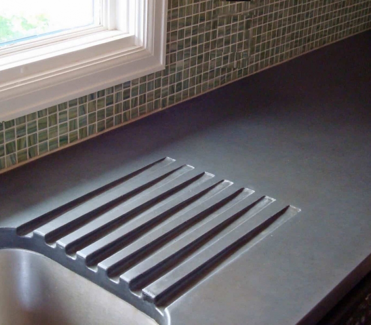 Integral concrete drainboard