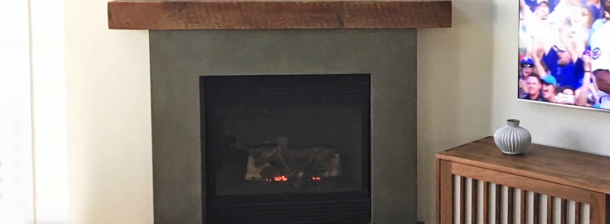 Reclaimed wood and concrete fireplace surround
