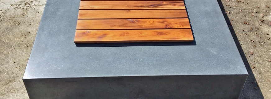 Concrete fire pit with teak cover
